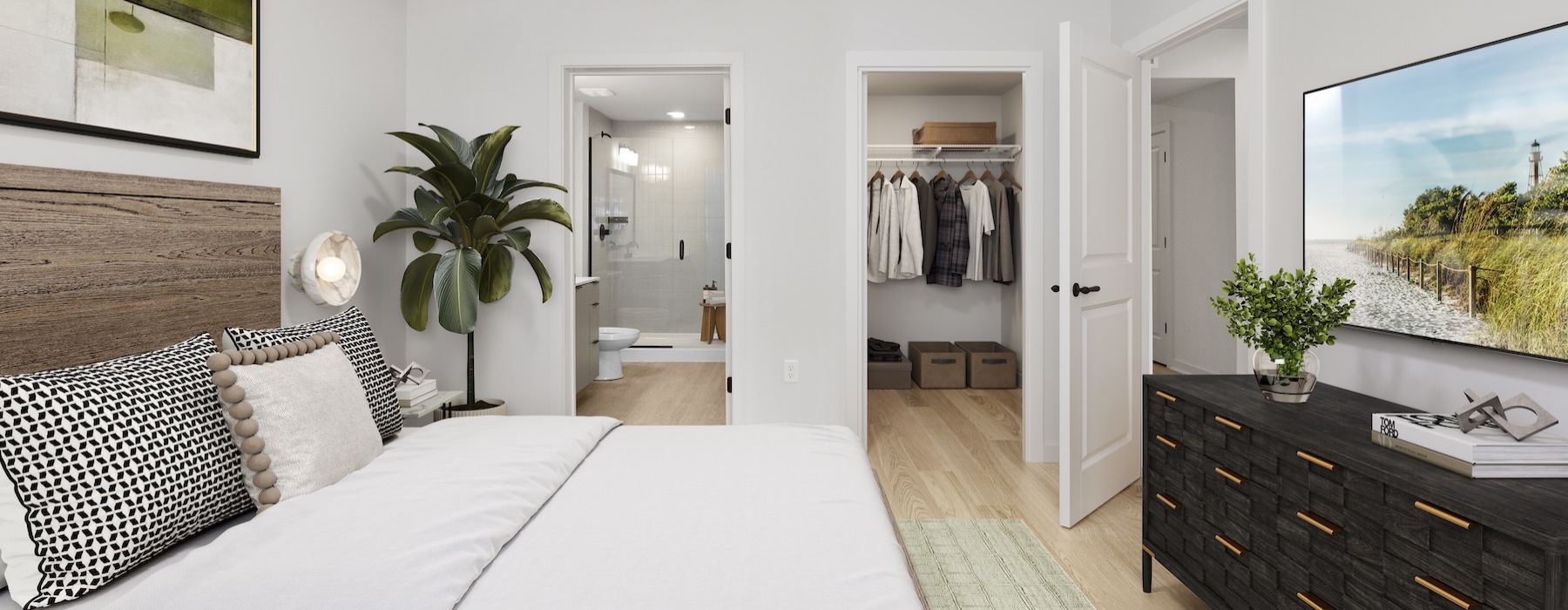 a bedroom with a bed and a plant