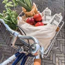 a bike basket with groceries