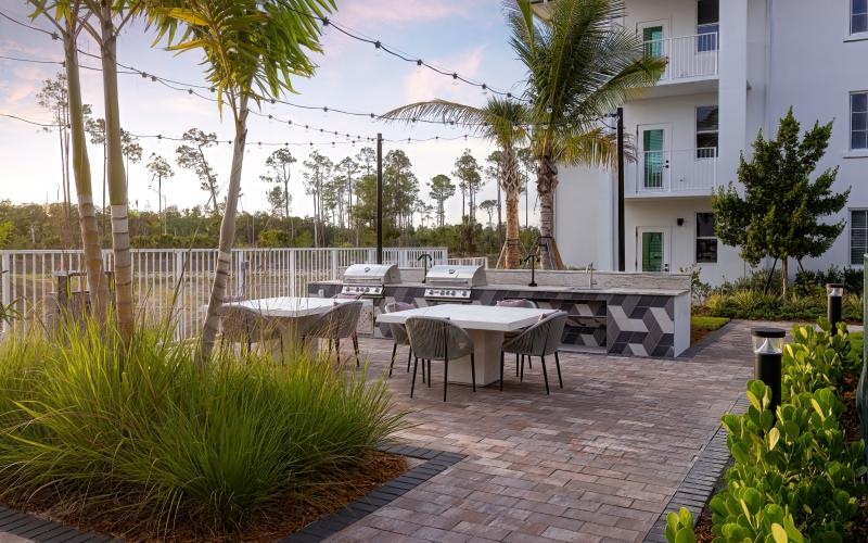 a patio with tables and chairs