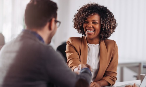man shaking hands with leasing agent