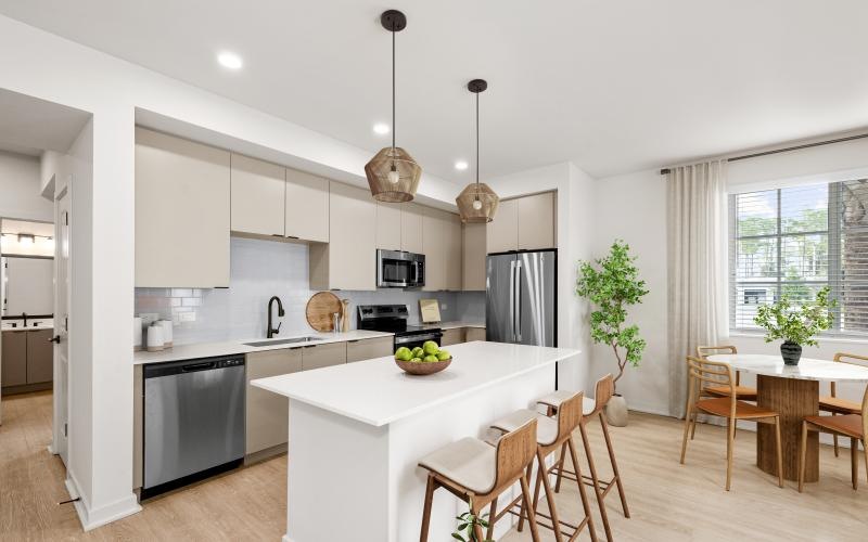 a kitchen with a table and chairs